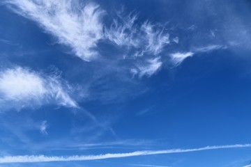 Beautiful white cirrus cloud formations on a deep blue sky