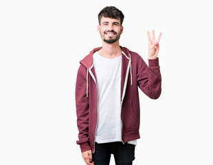 Young handsome man over isolated background showing and pointing up with fingers number three while smiling confident and happy.