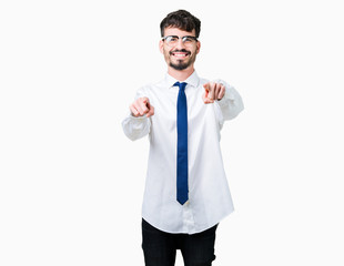 Young handsome business man wearing glasses over isolated background Pointing to you and the camera with fingers, smiling positive and cheerful