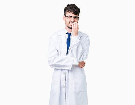 Young professional scientist man wearing white coat over isolated background looking stressed and nervous with hands on mouth biting nails. Anxiety problem.