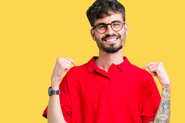Young handsome man wearing glasses over isolated background looking confident with smile on face,...