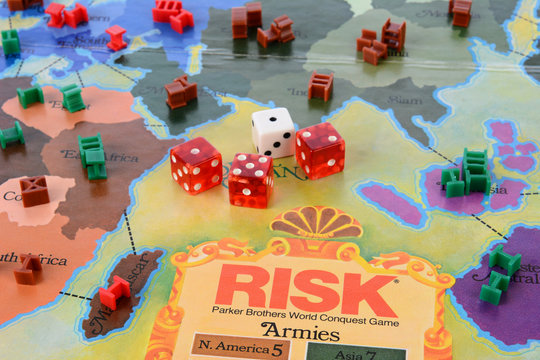 IRVINE, CA - MAY 19, 2014: Risk board game closeup. Risk is a strategy game where the objective is to occupy every territory on the board thereby eliminating the other players.