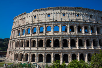 Fototapeta na wymiar The famous Colosseum or Coliseum also known as the Flavian Amphitheatre in the centre of the city of Rome