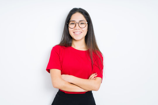 Beautiful brunette woman wearing glasses over isolated background happy face smiling with crossed arms looking at the camera. Positive person.