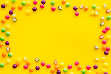 Candy dots frame for blog design on yellow background top view mockup