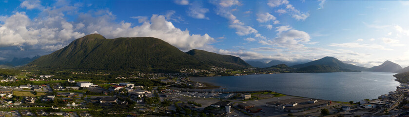 Fototapeta na wymiar Orsta Norway cityscape. Panoramic aerial view from drone at sunset in july 2019