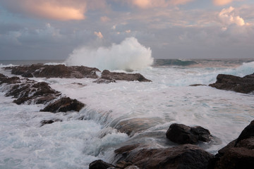 Water flow motion over rocks during big swell in Australia