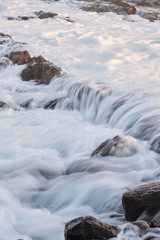 Water flow motion over rocks during big swell in Australia