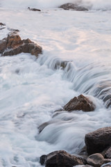 Water flow motion over rocks during big swell in Australia