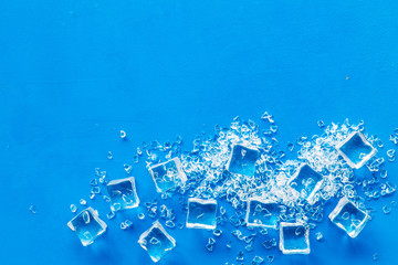 ice cubes on blue table top view moc-up