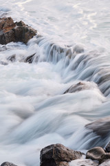 Water flow motion over rocks during big swell in Australia
