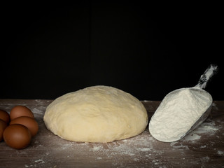 Cook is creating a dough to make bread.