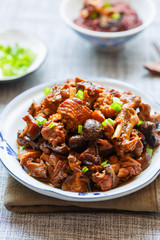braised chicken with shiitake mushroom in a plate closeup
