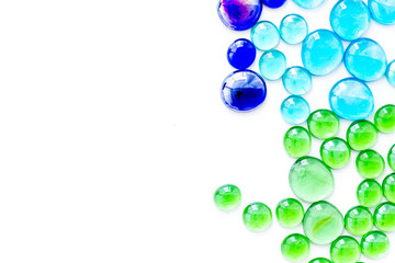 Shiny glass stones for decoration, creativity and craft on white background top view copyspace