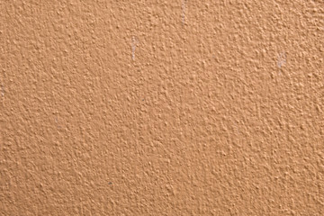 Brown cement wall background close up