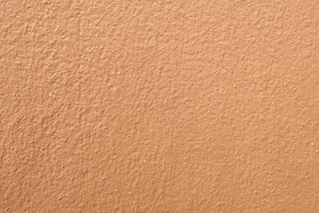 Brown cement wall background close up