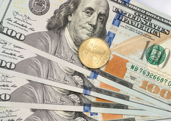 New 50 Halal coin on top of dollar bills