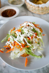 Flautas, 3 flour tortillas rolled with chipotle chicken, lettuce, tomatillo avocado salsa, pickled carrots, queso fresco, crema, taquitos 
