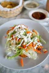 Flautas, 3 flour tortillas rolled with chipotle chicken, lettuce, tomatillo avocado salsa, pickled carrots, queso fresco, crema, taquitos 