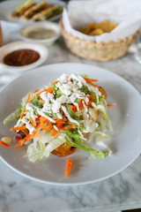 Flautas, 3 flour tortillas rolled with chipotle chicken, lettuce, tomatillo avocado salsa, pickled carrots, queso fresco, crema, taquitos 