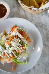 Flautas, 3 flour tortillas rolled with chipotle chicken, lettuce, tomatillo avocado salsa, pickled carrots, queso fresco, crema, taquitos 