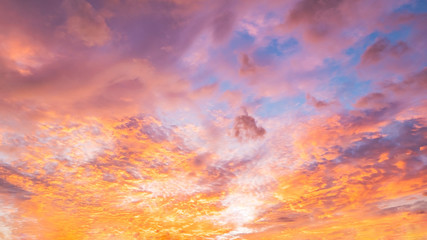 Dramatic vibrant color with beautiful cloud of sunrise and sunset on a cloudy day. Panoramic image.