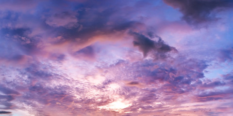 Fototapeta na wymiar Dramatic vibrant color with beautiful cloud of sunrise and sunset on a cloudy day. Panoramic image.