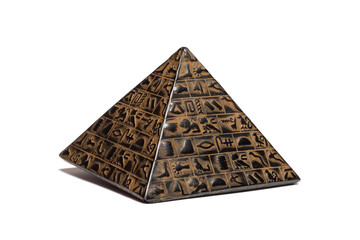 pyramid figurine stands on a white background