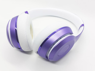 Beautiful Modern Elegant Purple Color Audio Headset with Wireless Electronic Technology in White Isolated Background