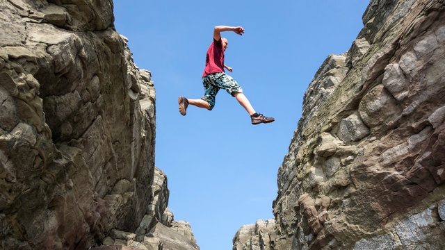 Man jump over the rocks