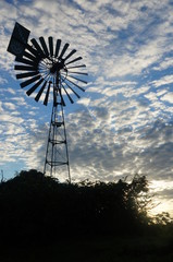 old windmill against blue sky