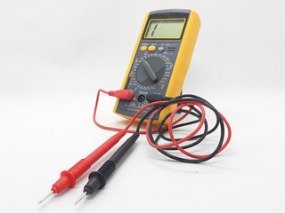 Yellow Modern Digital Electronic Multi Meter with Ohm Ampere Volt and Watt Measurement with Red and Black Probe in White Isolated Background