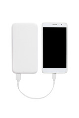 Smartphone charging with power bank on white background with clipping path