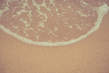 Beach sand and ocean waves