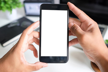 Cropped shot view of man hands holding smart phone with blank copy space screen for your text message or information content, female reading text message on cell telephone during in urban setting. 