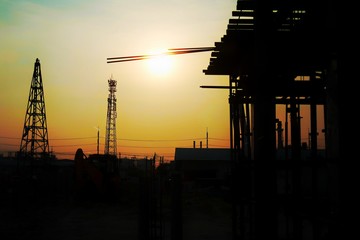 silhouette of construction site at sunset