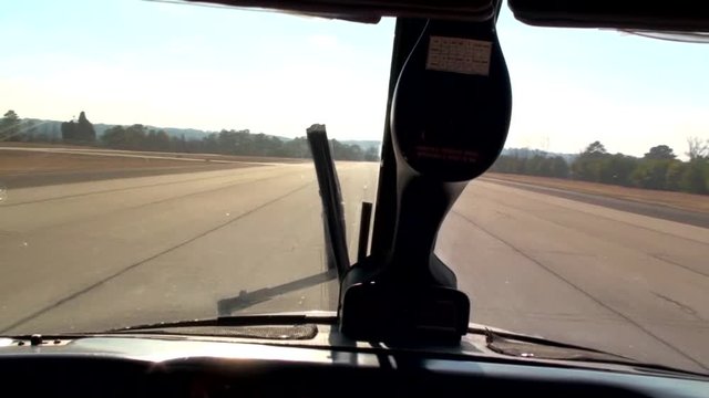 Piper Navajo Chieftain landing from final approach to the runway at the airport and continues down the runway reducing speed.