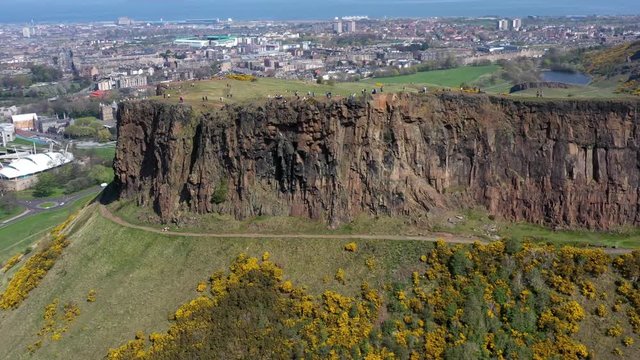 Panning Around The Crags at Arthur's Seat, near Holyrood Parliament, with Tourists Walking | Edinburgh, Scotland | 4K at 30 fps