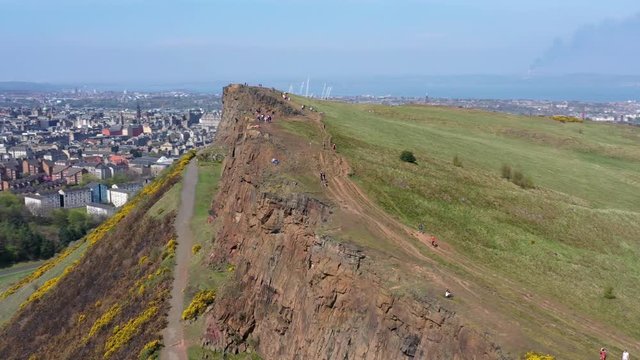 Panning Around The Crags at Arthur's Seat, near Holyrood Parliament, with Tourists Walking | Edinburgh, Scotland | 4K at 30 fps