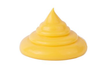 Drop of tasty yellow cheese sauce on a white background