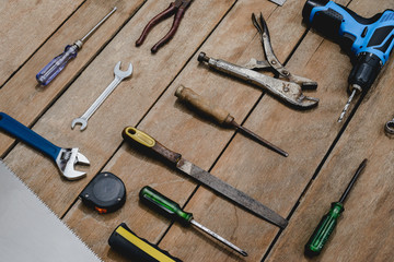 old instruments constructor or renovation for build and repair house on wooden background