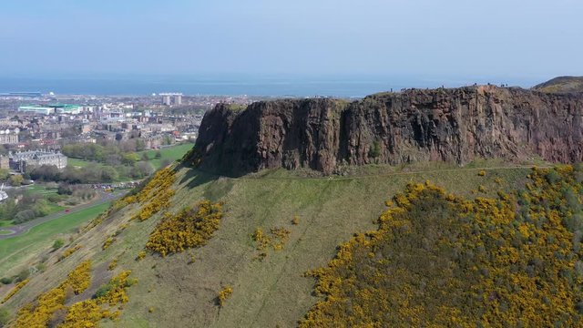 Orbit Around The Crags at Arthur's Seat, near Holyrood Parliament, with Tourists Walking | Edinburgh, Scotland | 4K at 30 fps