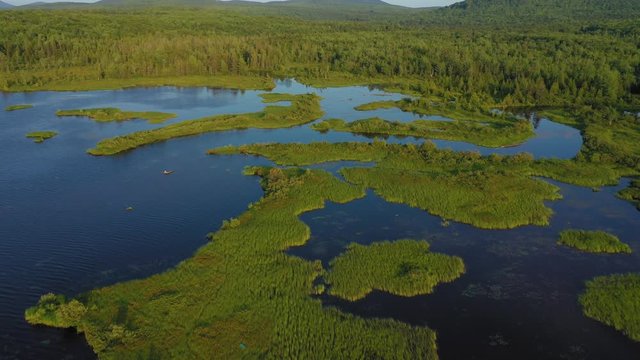 Aerial flight over Rangeley Lake lush scenery