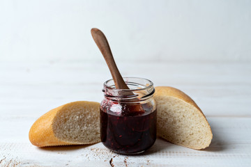 pieces wheat mini baguette with homemade jam. Sweet snack.