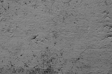 Texture of a concrete wall with cracks and scratches which can be used as a background