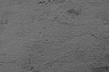 Texture of a concrete wall with cracks and scratches which can be used as a background