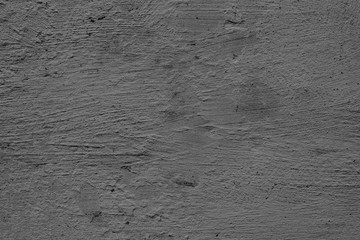 Texture of a concrete wall with cracks and scratches which can be used as a background