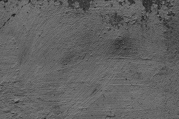 Texture of a concrete wall with cracks and scratches which can be used as a background
