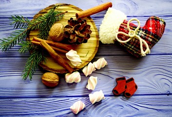 Christmas composition with toys, fir, cones, nuts and cinnamon
