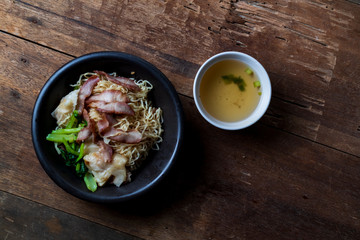 Traditional Thai egg noodles on wooden table top